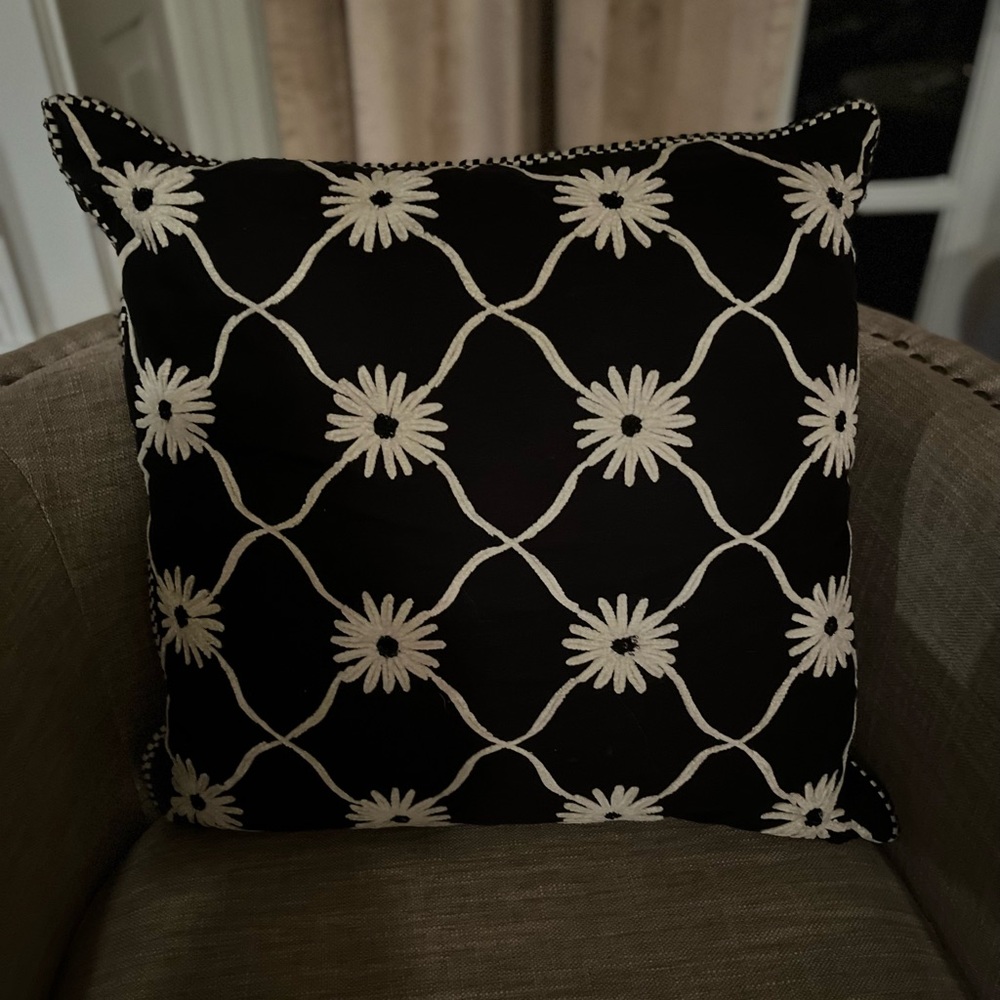 Single throw pillow with floral accents